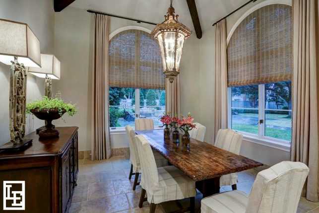 Ambient lighting, when combined with accent lighting, can make a practical space like this breakfast room space feel inviting and cozy. 