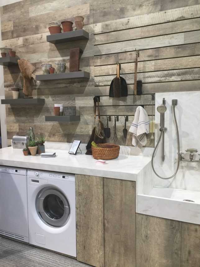 This utility room designed with Wilsonart's new Rediscovered Oak was complete with a functional slat wall and dog wash.