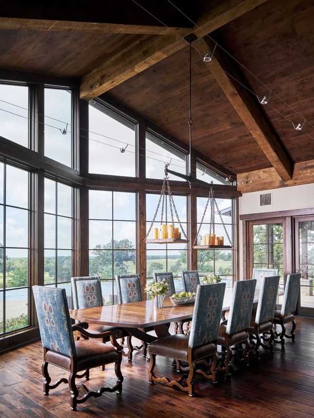 Ranch Dining Room with custom made Chandelier from Antique Scales and a cable lighting. Combination of old and new.